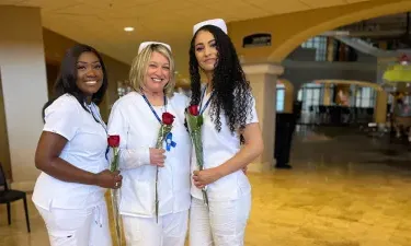 Orlando Nursing Graduates Smiling with Roses