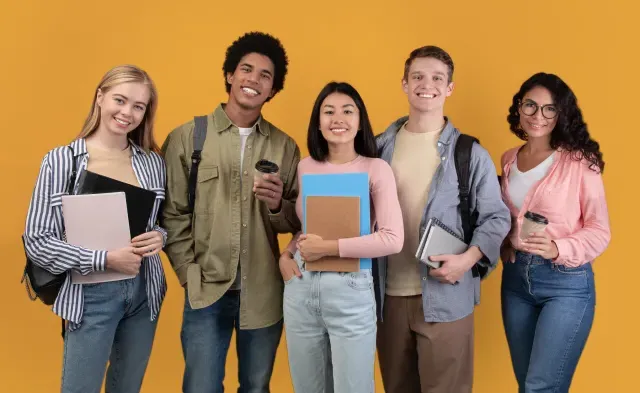 Five college students holding notebooks and folders